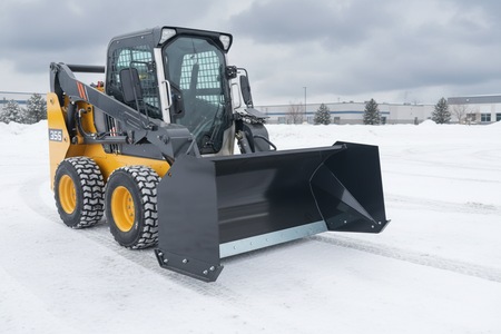 Snow pusher yellow side - snowy scene